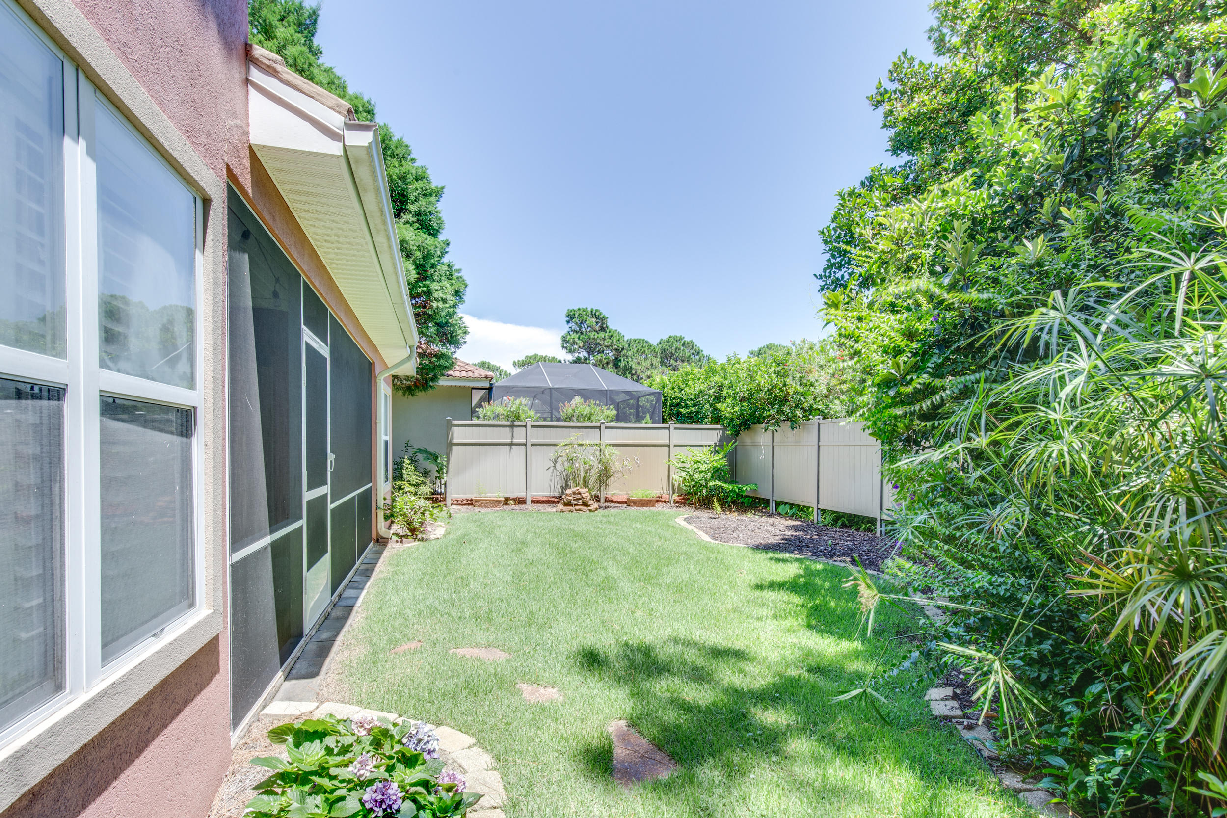 244 Indigo Loop Destin, FL 32550 - Photo 29 of 41 a view of a backyard with garden