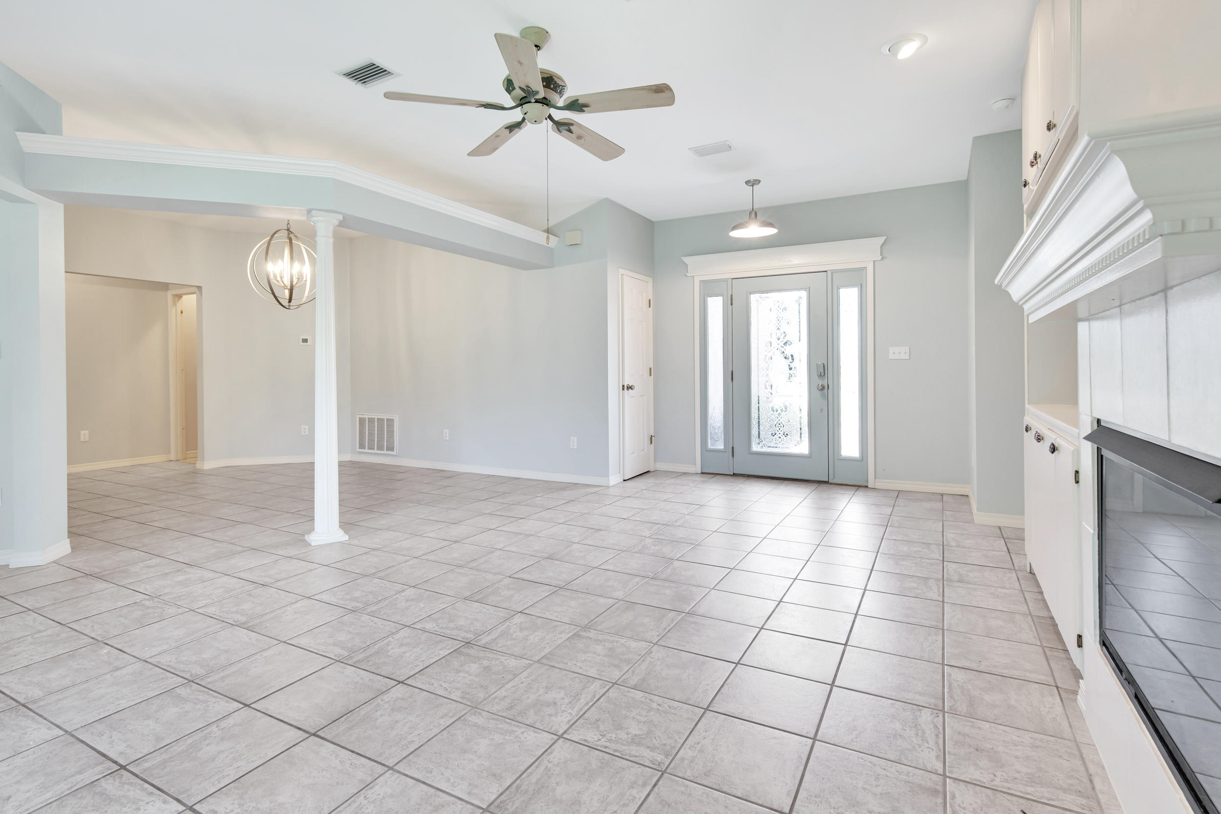 244 Indigo Loop Destin, FL 32550 - Photo 4 of 41 a view of a livingroom with a chandelier fan and windows