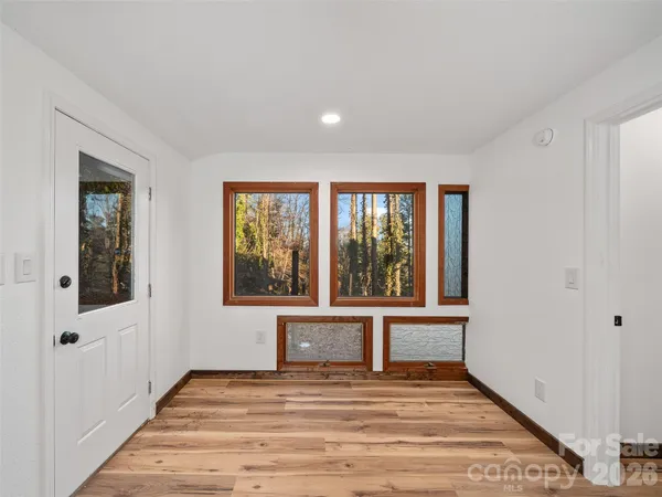 a view of an empty room with a window