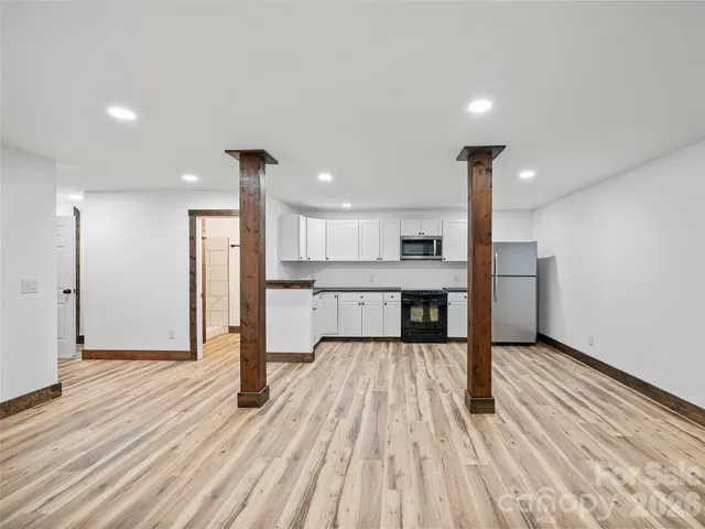 a view of kitchen with wooden floor