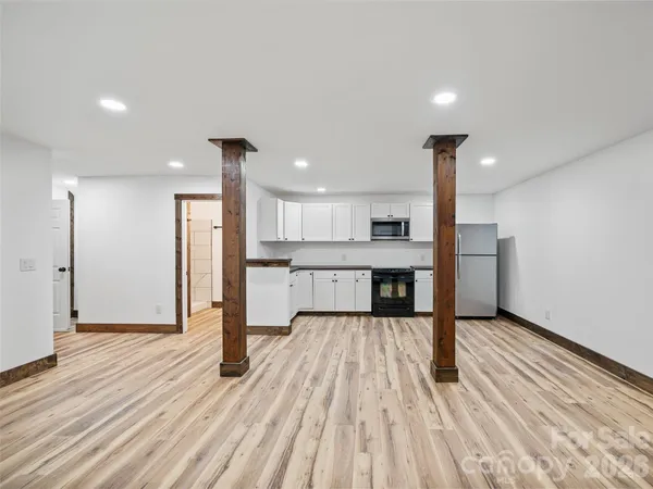a view of kitchen with wooden floor