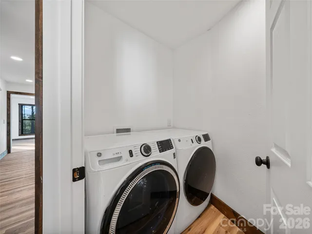a view of storage and utility room with washer and dryer