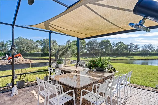 a view of an outdoor sitting area with a lake view