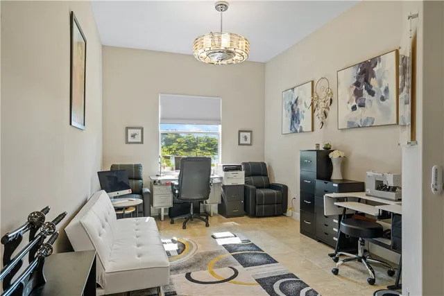 a view of a livingroom with furniture and a window