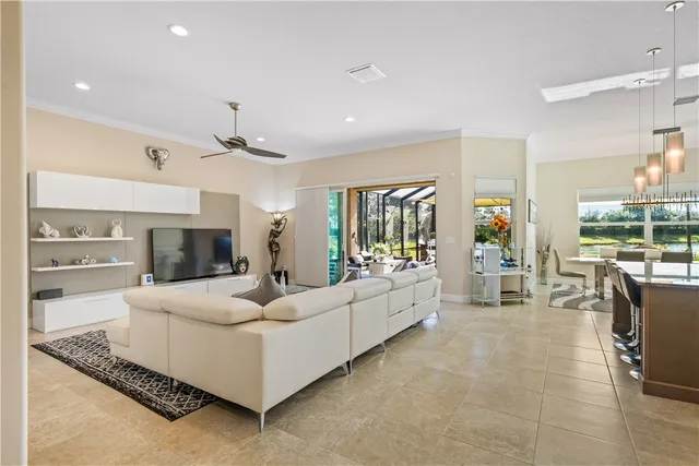 a living room with fireplace furniture and a large window