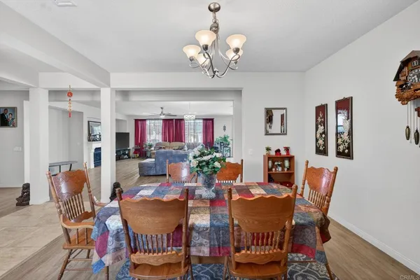 a dining room with furniture and window