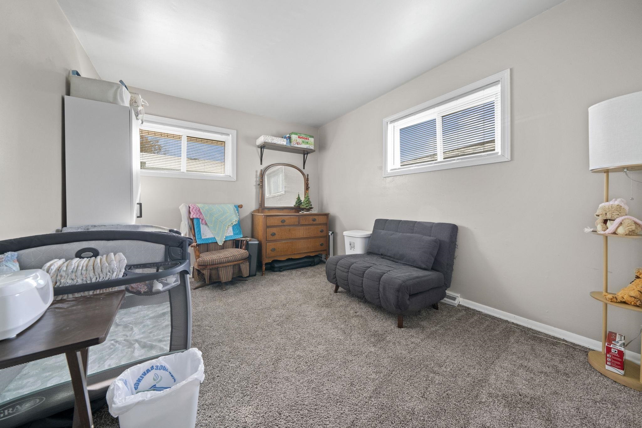 601 West 1st Street Mount Morris, IL 61054 - Photo 20 of 28 a living room with furniture and a window
