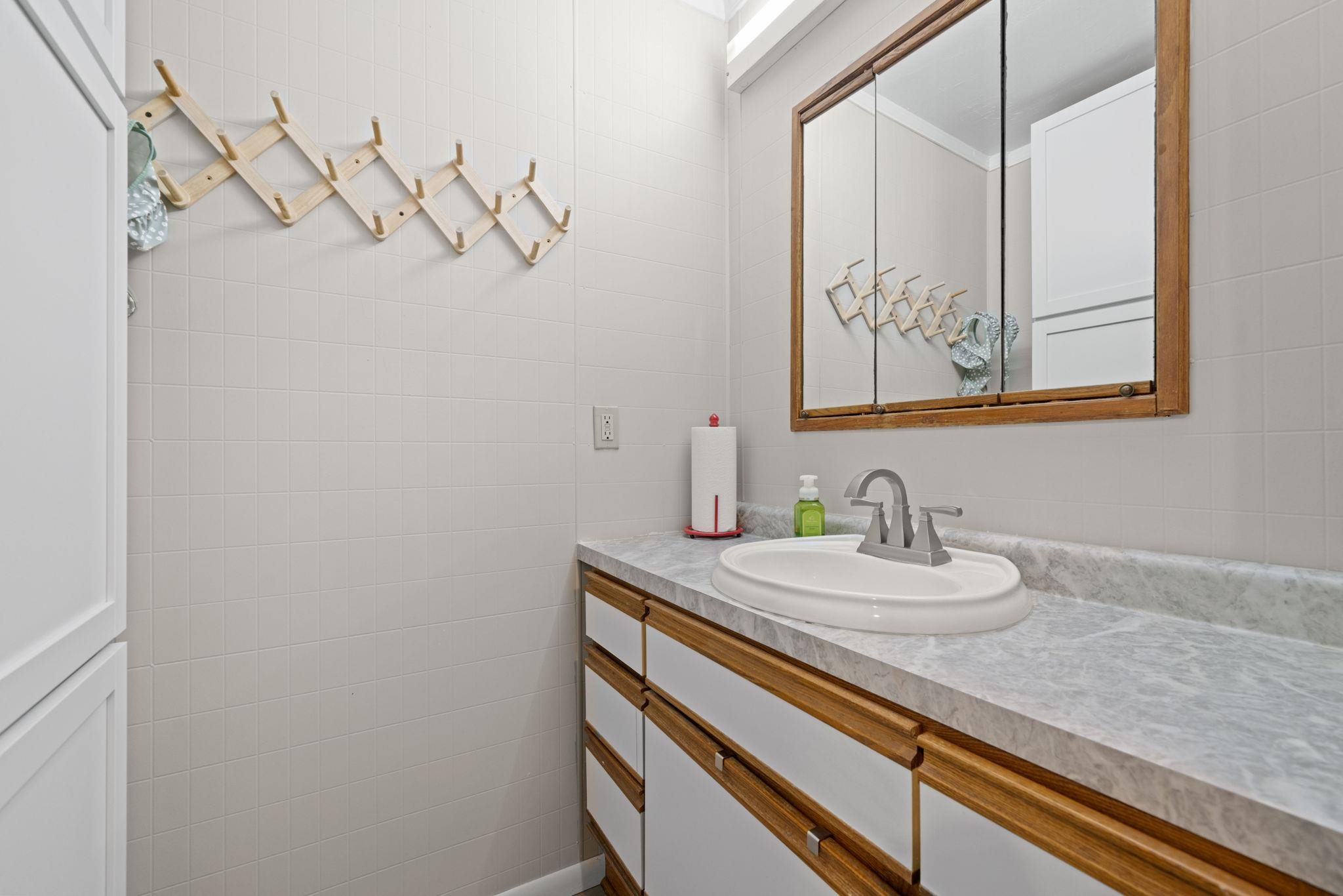 601 West 1st Street Mount Morris, IL 61054 - Photo 22 of 28 a bathroom with a sink and a mirror
