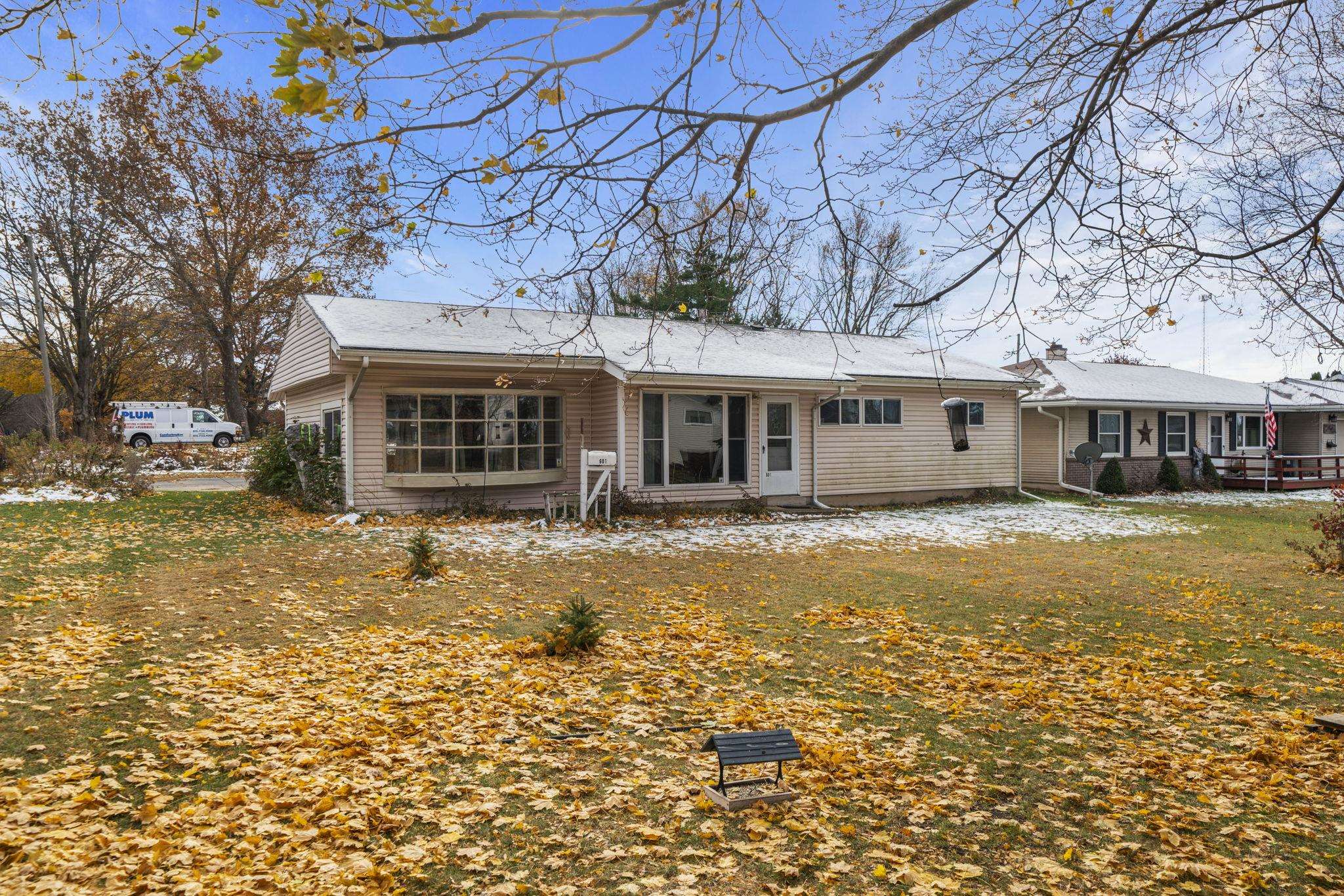 601 West 1st Street Mount Morris, IL 61054 - Photo 25 of 28 a front view of a house with a yard