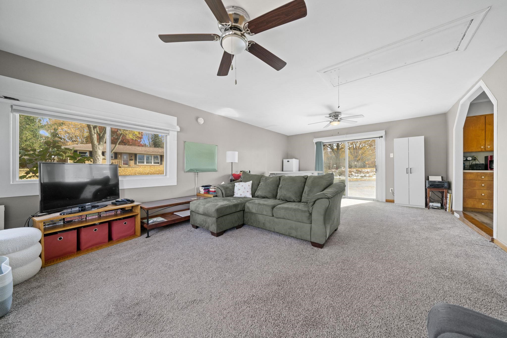 601 West 1st Street Mount Morris, IL 61054 - Photo 9 of 28 a living room with furniture and a flat screen tv
