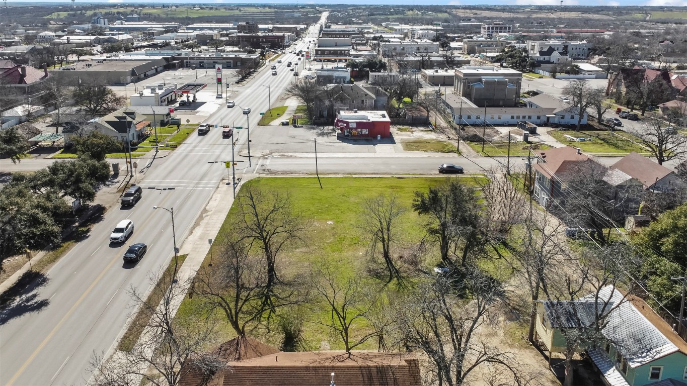 703 North Main Street Taylor, TX 76574 - Photo 20 of 23 an aerial view of a swimming pool with a yard