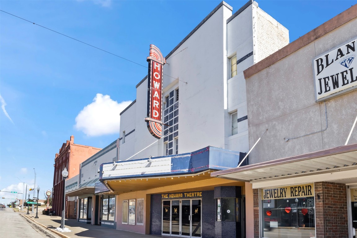 703 North Main Street Taylor, TX 76574 - Photo 5 of 23 a view of a building with a lot of people