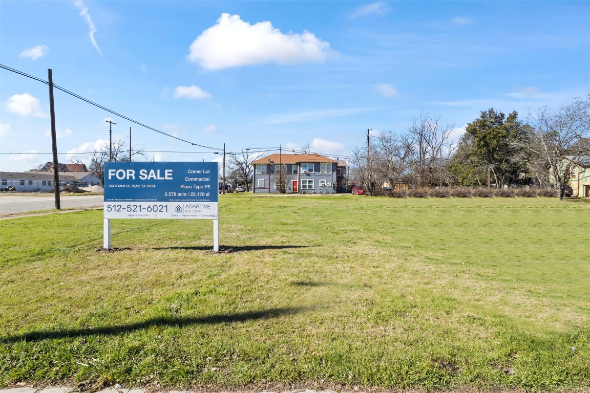 703 North Main Street Taylor, TX 76574 - Photo 7 of 23 a view of a street with houses in the background