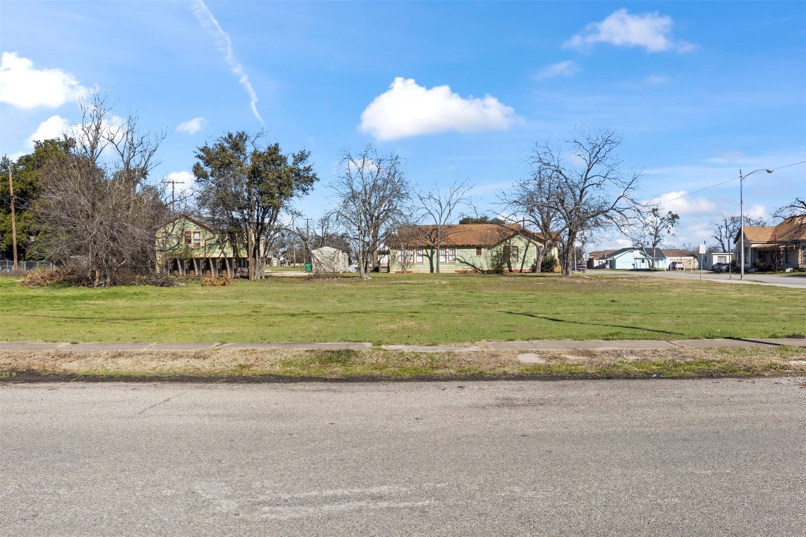 703 North Main Street Taylor, TX 76574 - Photo 9 of 23 a view of a lawn chairs and a big yard