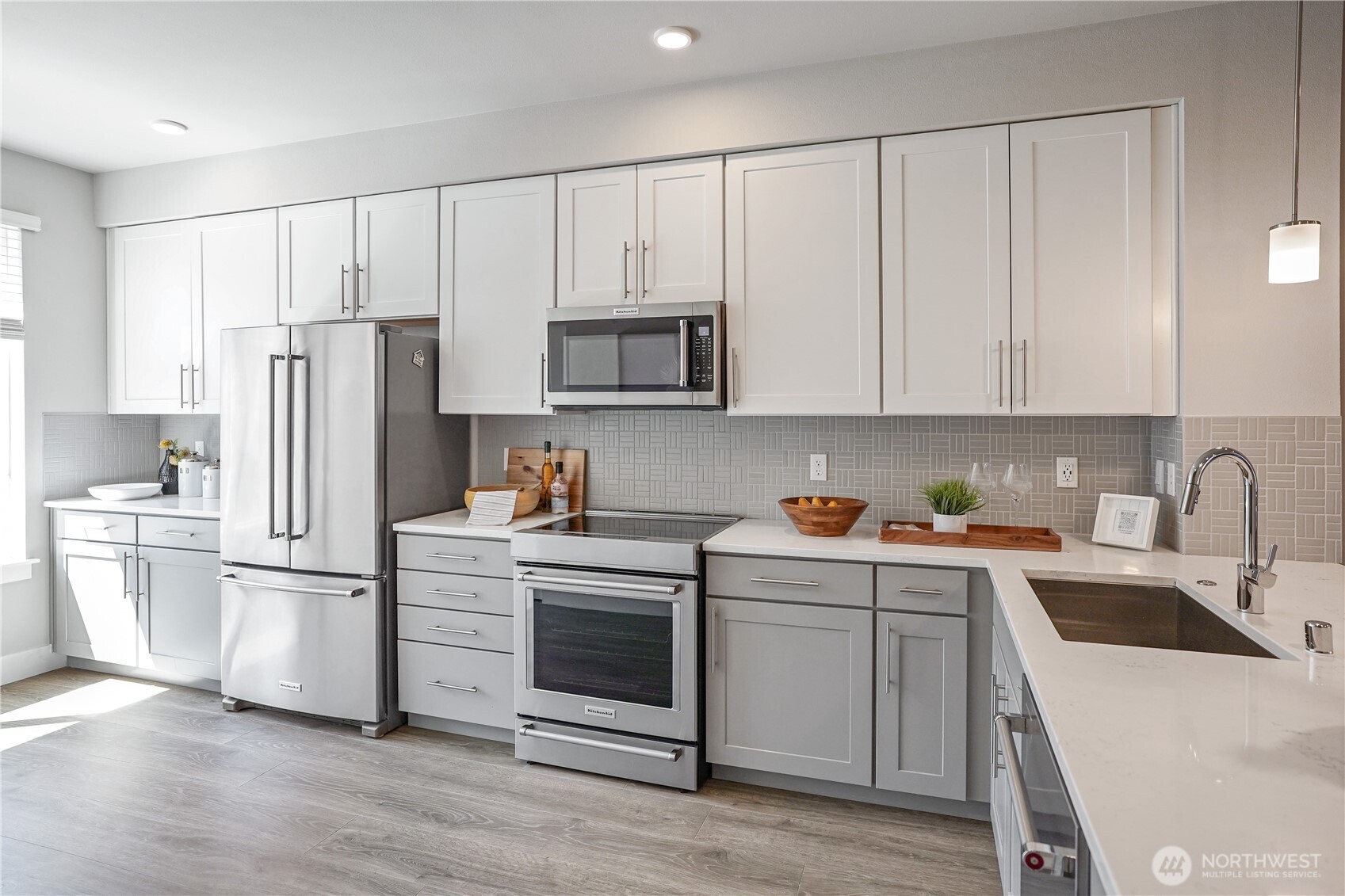 825 238th Place Southeast, Unit D Bothell, WA 98021 - Photo 8 of 22 a kitchen with a sink white cabinets and stainless steel appliances