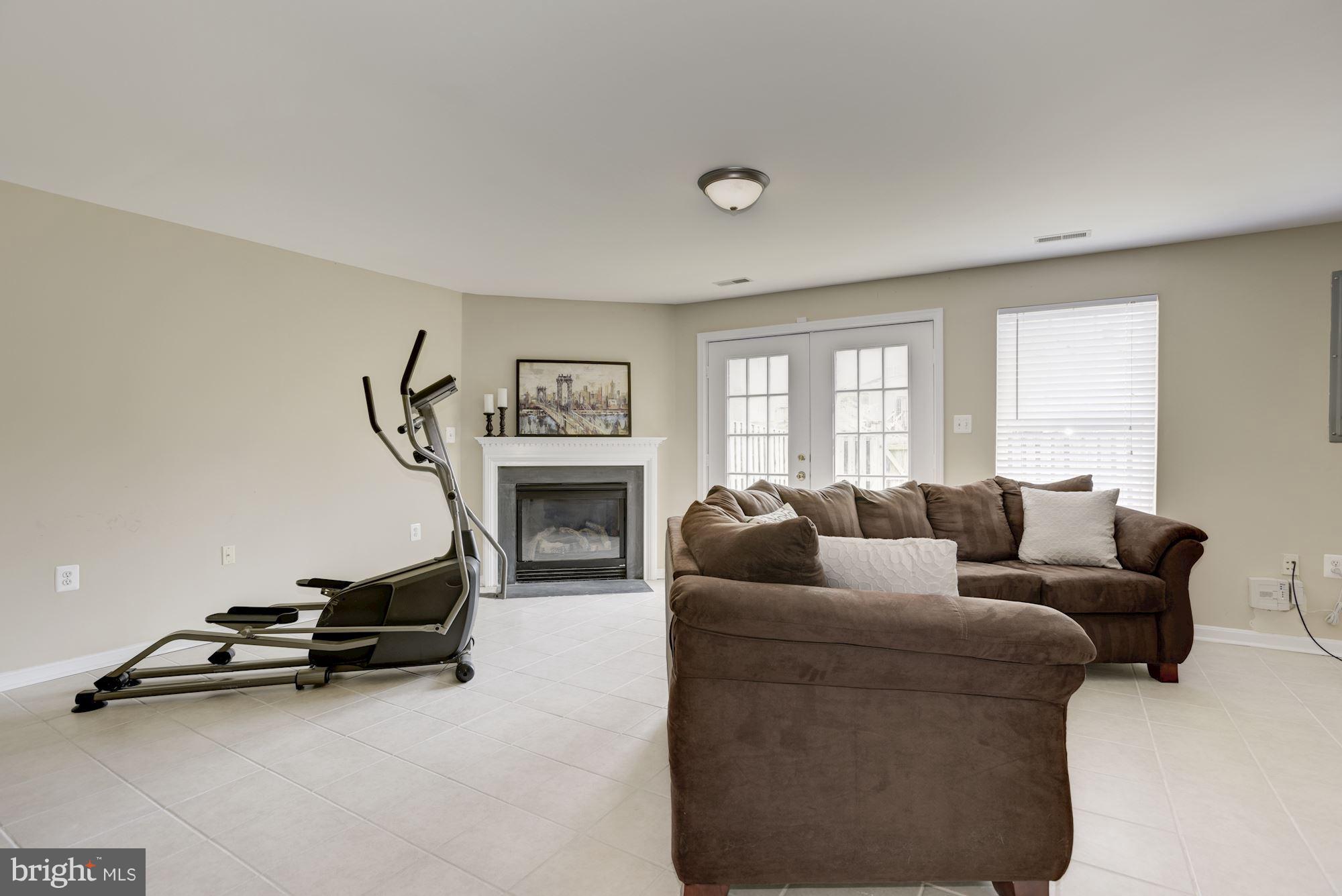 629 Springhouse Square Southeast Leesburg, VA 20175 - Photo 23 of 29 Gas fireplace with mantle on lower level