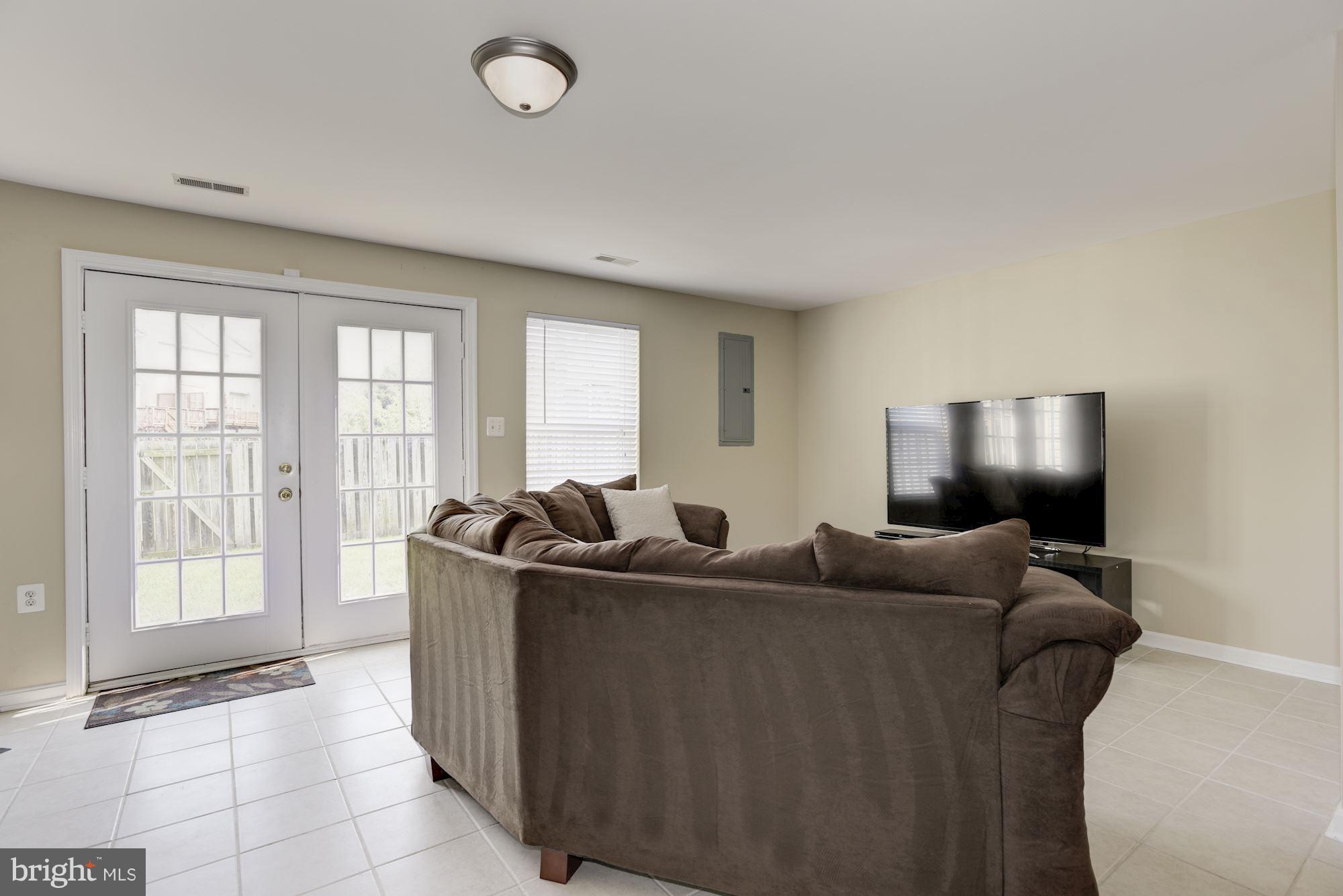 629 Springhouse Square Southeast Leesburg, VA 20175 - Photo 24 of 29 cozy movie area and walk out to fenced yard
