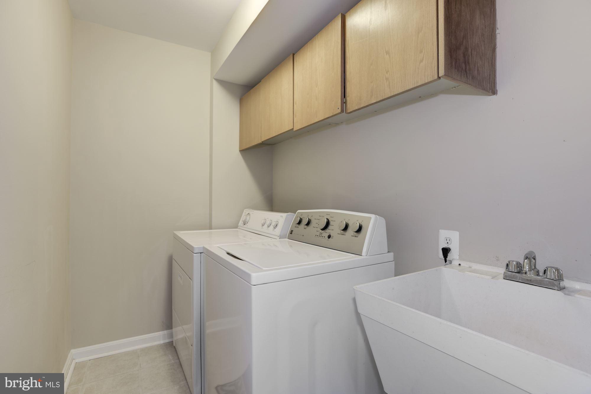 629 Springhouse Square Southeast Leesburg, VA 20175 - Photo 26 of 29 separate laundry with wash sink and cabinets