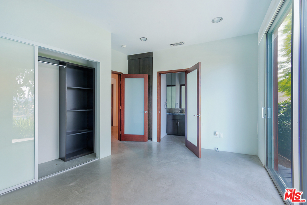 2337 Baxter Street Los Angeles, CA 90039 - Photo 12 of 16 an empty room with closet and wooden floor