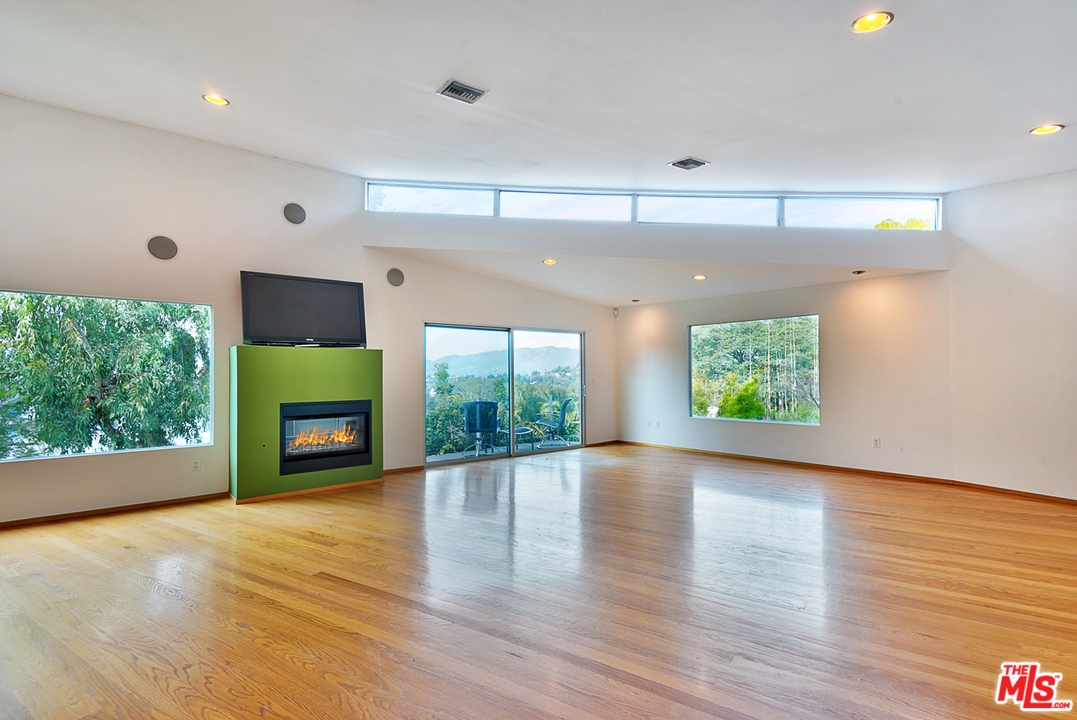 2337 Baxter Street Los Angeles, CA 90039 - Photo 2 of 16 a view of an empty room with a window and fire place