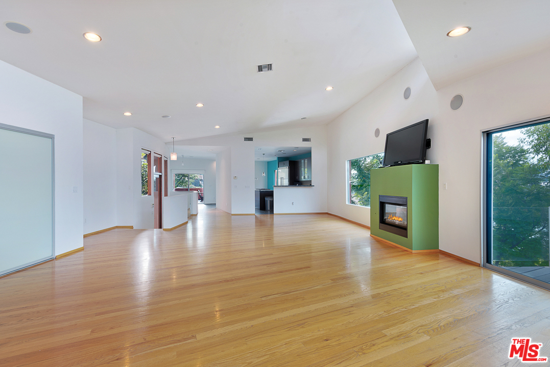 2337 Baxter Street Los Angeles, CA 90039 - Photo 5 of 16 a view of an empty room with furniture and a flat screen tv