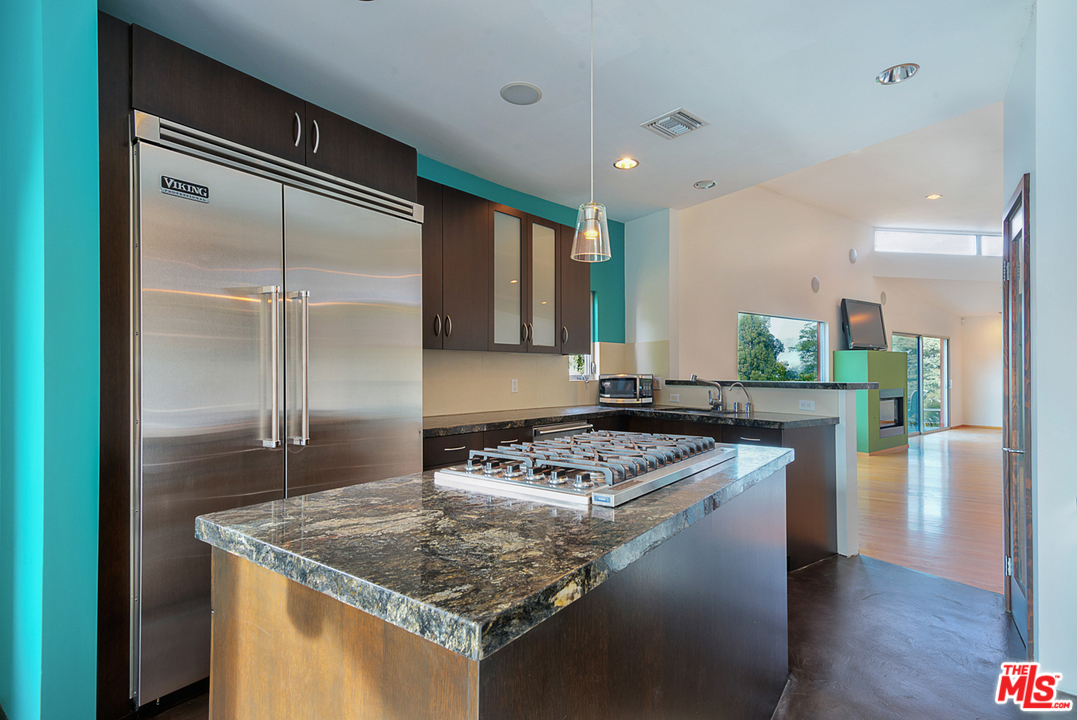 2337 Baxter Street Los Angeles, CA 90039 - Photo 6 of 16 a kitchen with stainless steel appliances granite countertop a sink stove and refrigerator