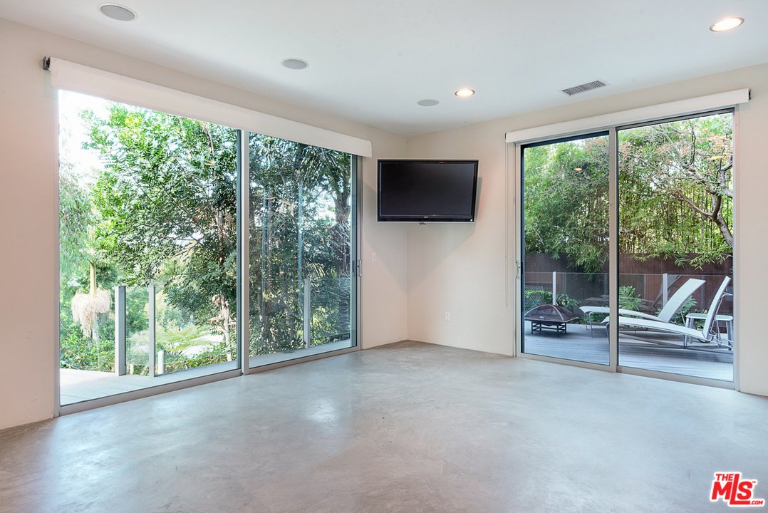 2337 Baxter Street Los Angeles, CA 90039 - Photo 10 of 16 a living room with furniture tv and large windows