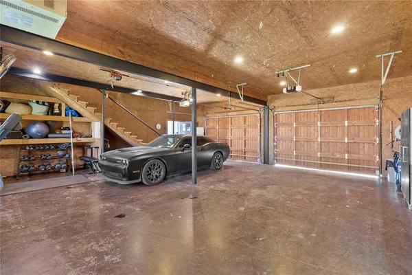 a view of parking garage with cars