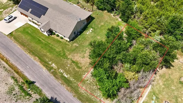 a aerial view of a house with a yard