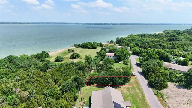 a view of a lake with a yard