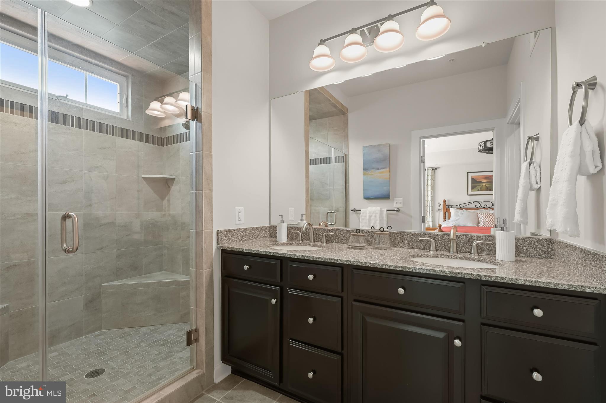 11285 Terrace Lane Fulton, MD 20759 - Photo 32 of 52 a bathroom with a granite countertop sink a mirror and a shower