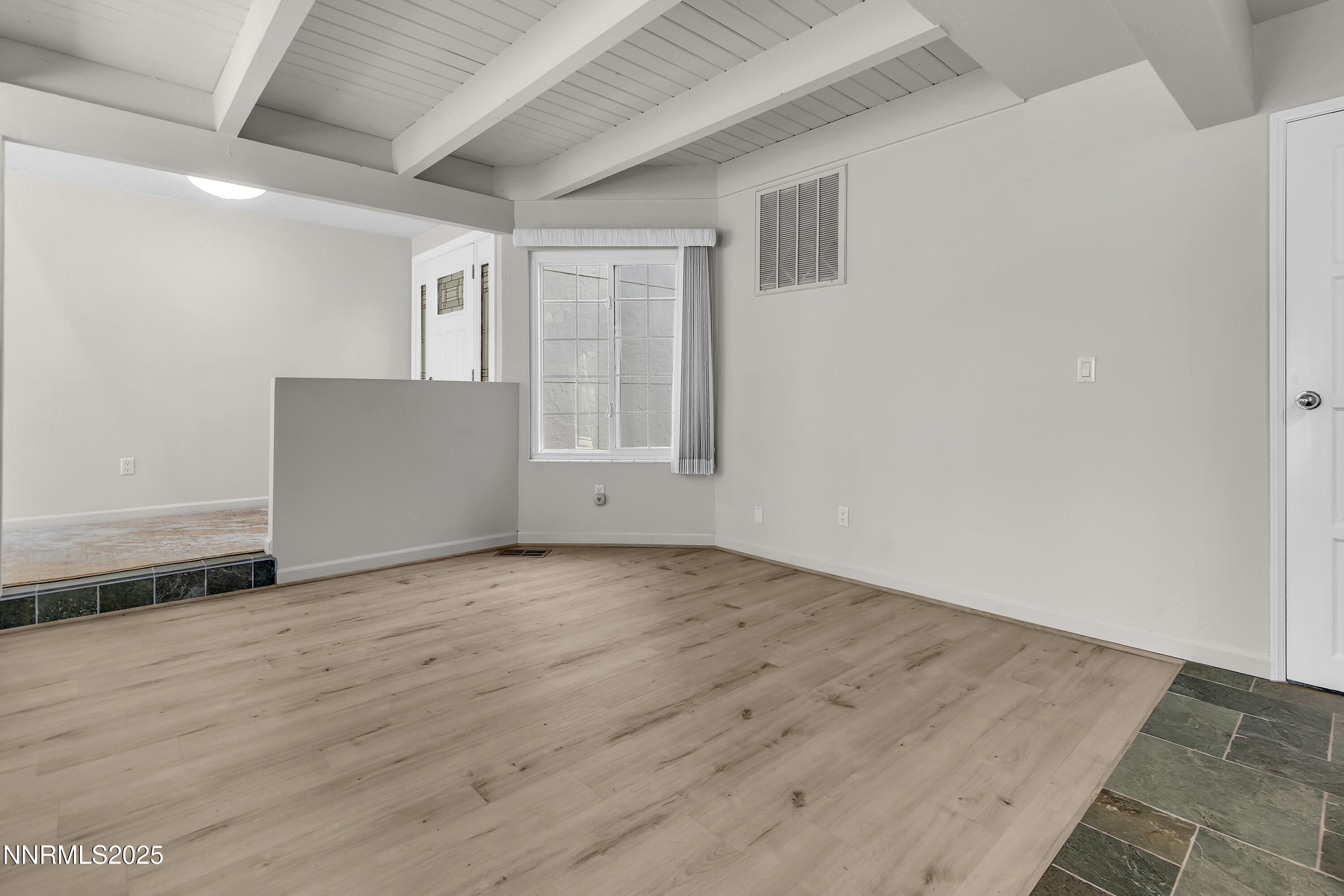 4314 Clyde Court Reno, NV 89509 - Photo 15 of 46 an empty room with wooden floor and windows
