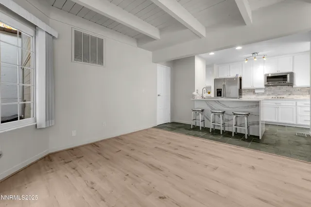 a kitchen with a table and chairs in it