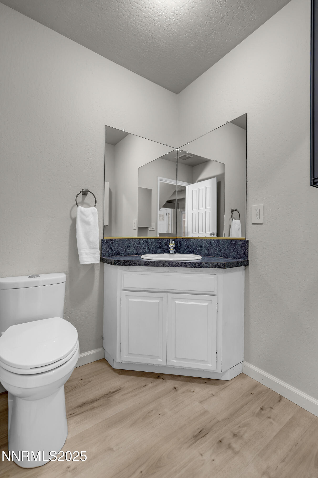 4314 Clyde Court Reno, NV 89509 - Photo 18 of 46 a bathroom with a granite countertop toilet and a sink