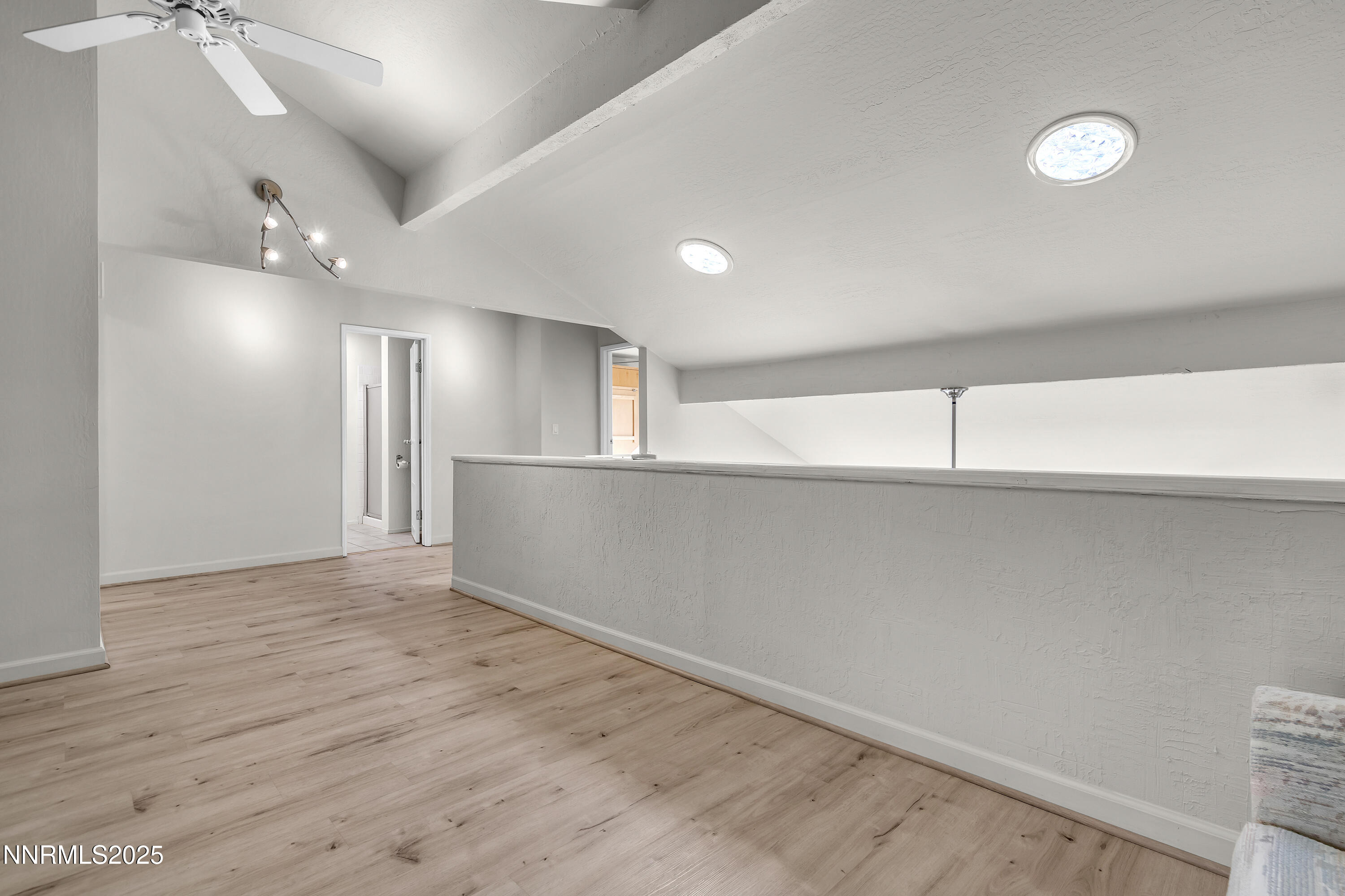 4314 Clyde Court Reno, NV 89509 - Photo 21 of 46 an empty room with wooden floor and windows