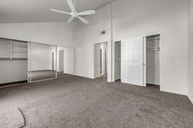 an empty room with a empty space and windows