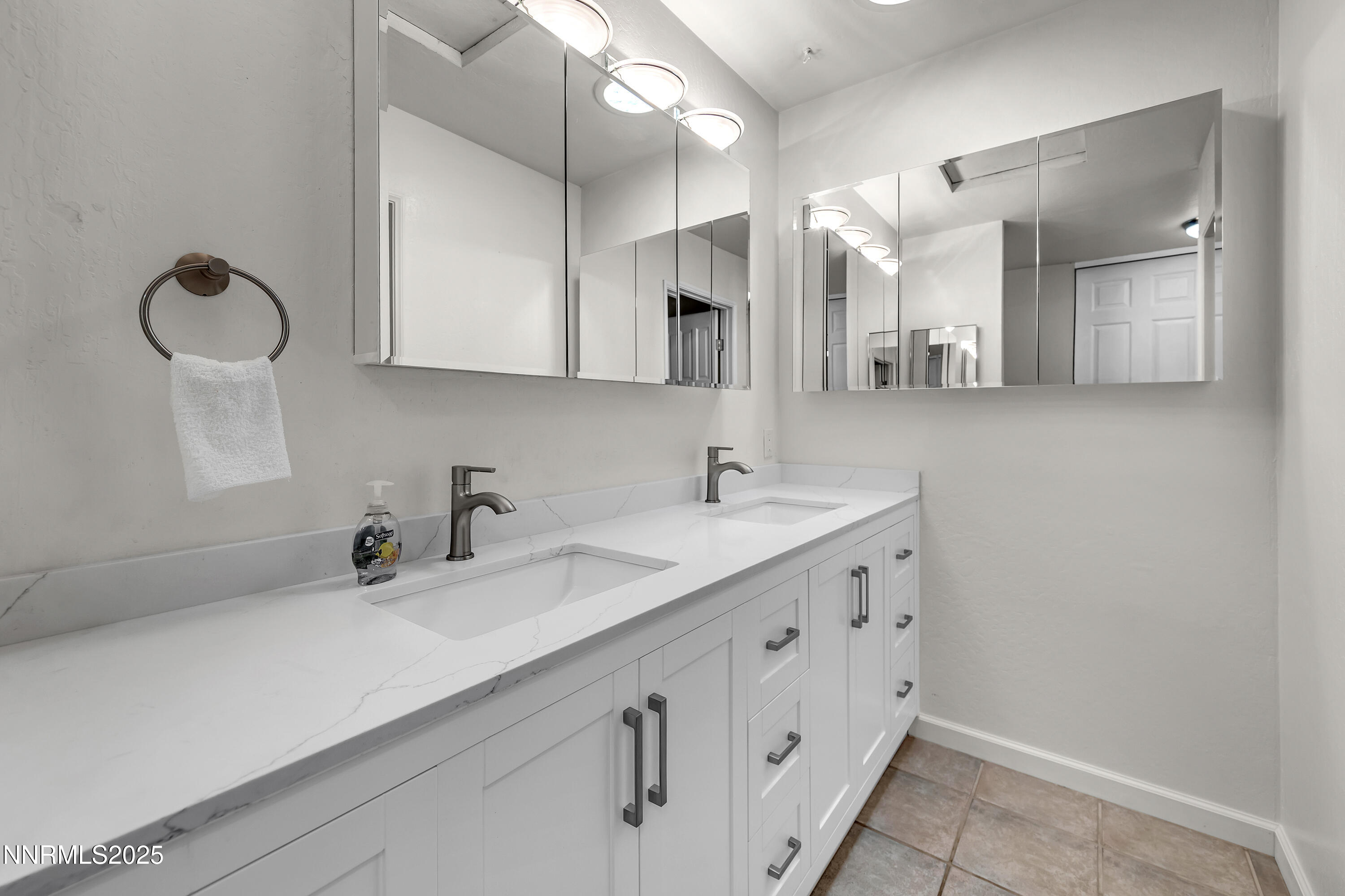 4314 Clyde Court Reno, NV 89509 - Photo 26 of 46 a bathroom with a double vanity sink and a mirror