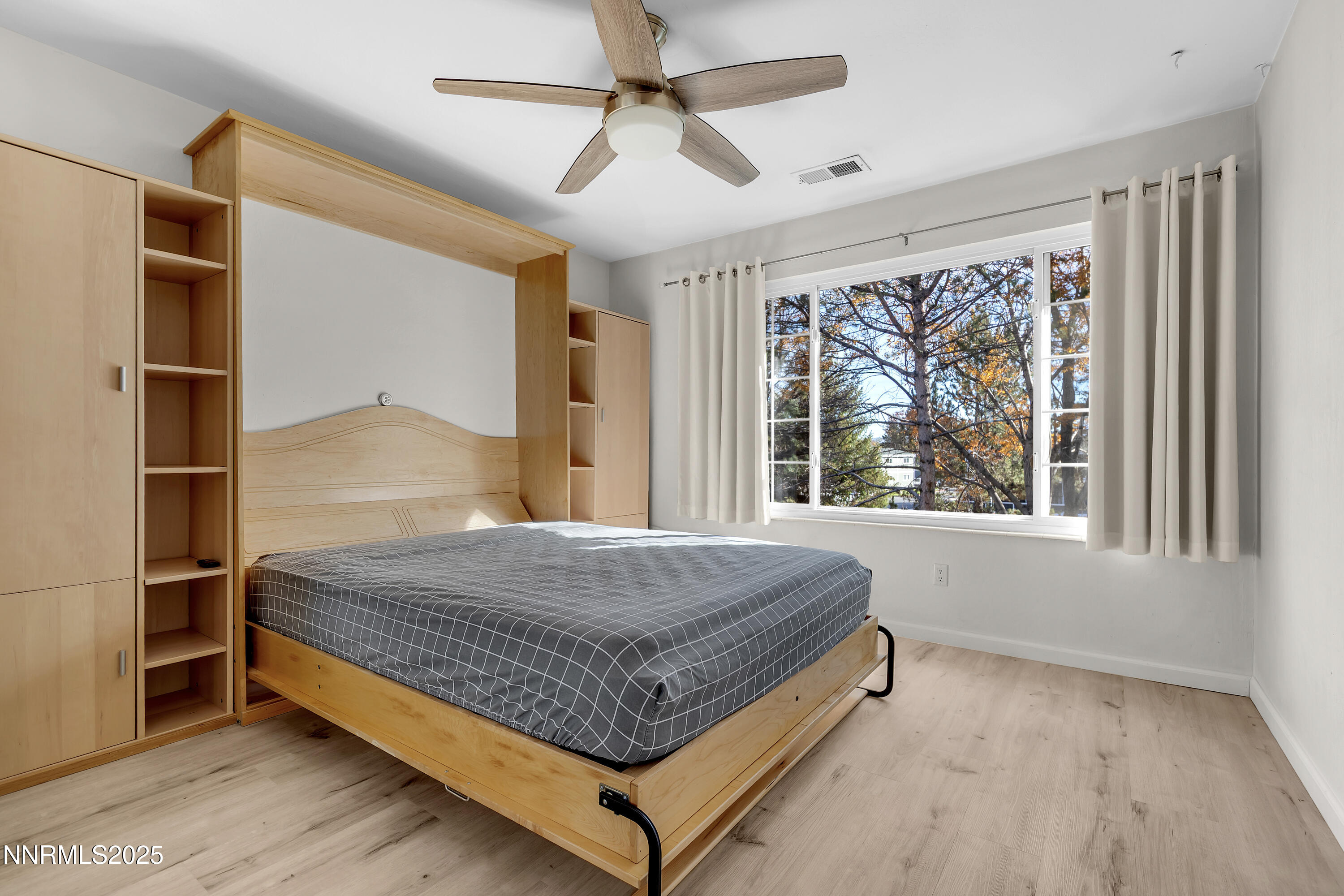 4314 Clyde Court Reno, NV 89509 - Photo 30 of 46 a bed sitting in a spacious bedroom next to a window