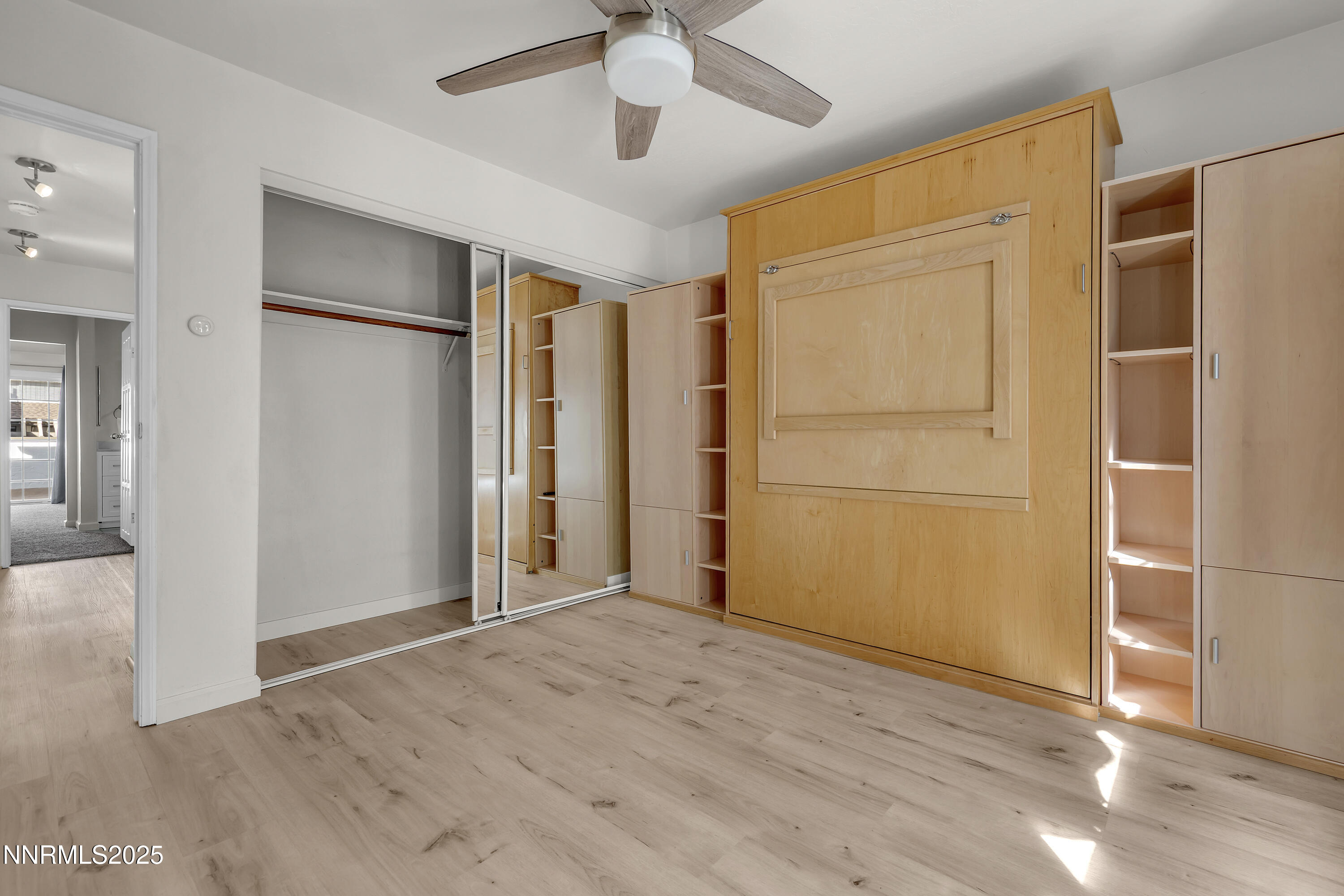 4314 Clyde Court Reno, NV 89509 - Photo 32 of 46 an empty room with wooden floor and a ceiling fan