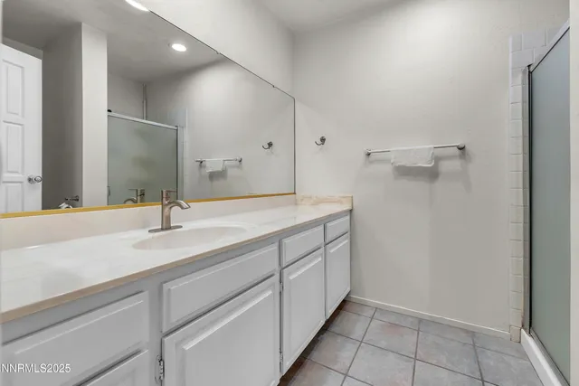 a view of a livingroom with wooden floor and staircase