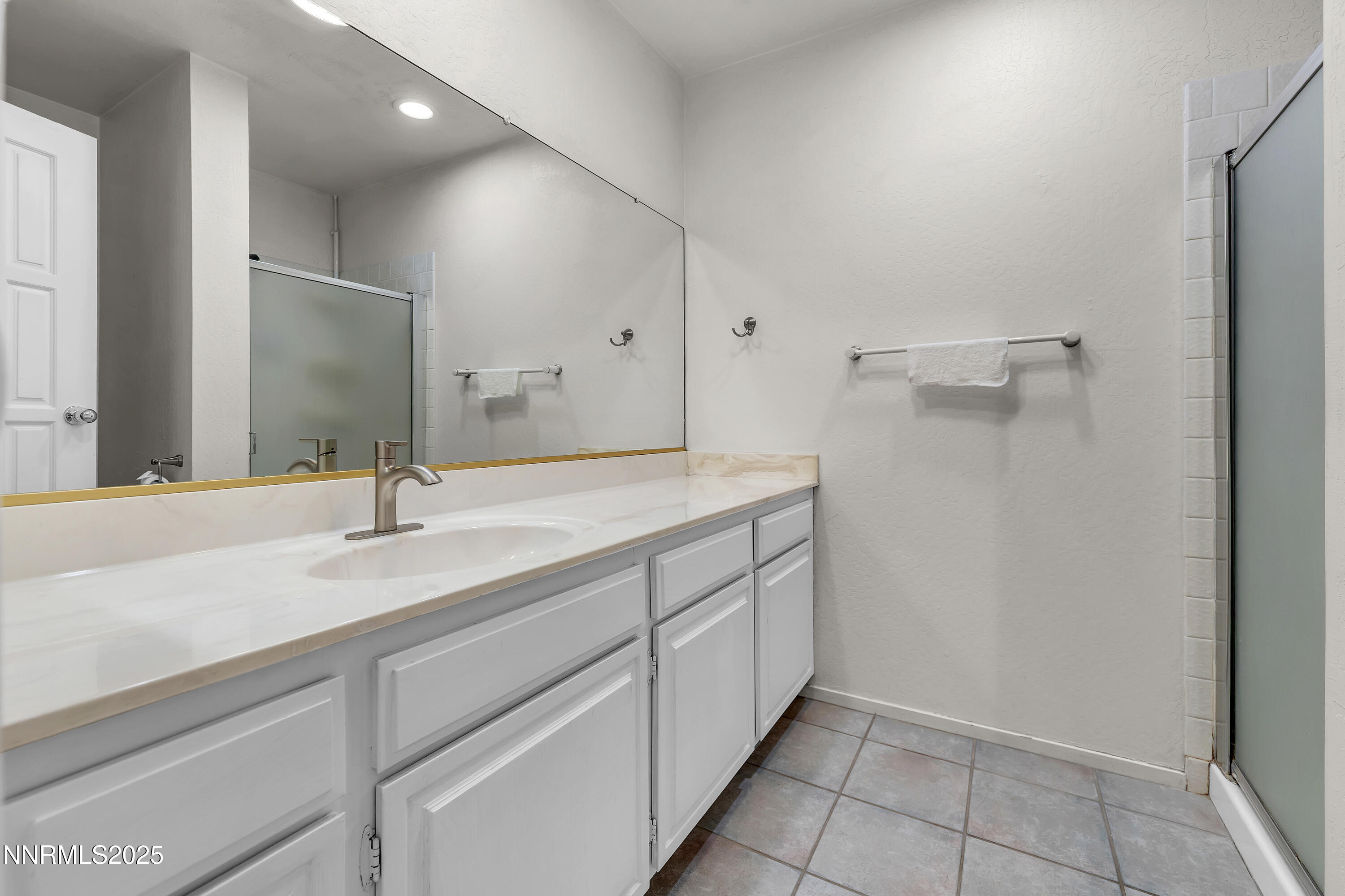 4314 Clyde Court Reno, NV 89509 - Photo 33 of 46 a bathroom with a sink and a mirror