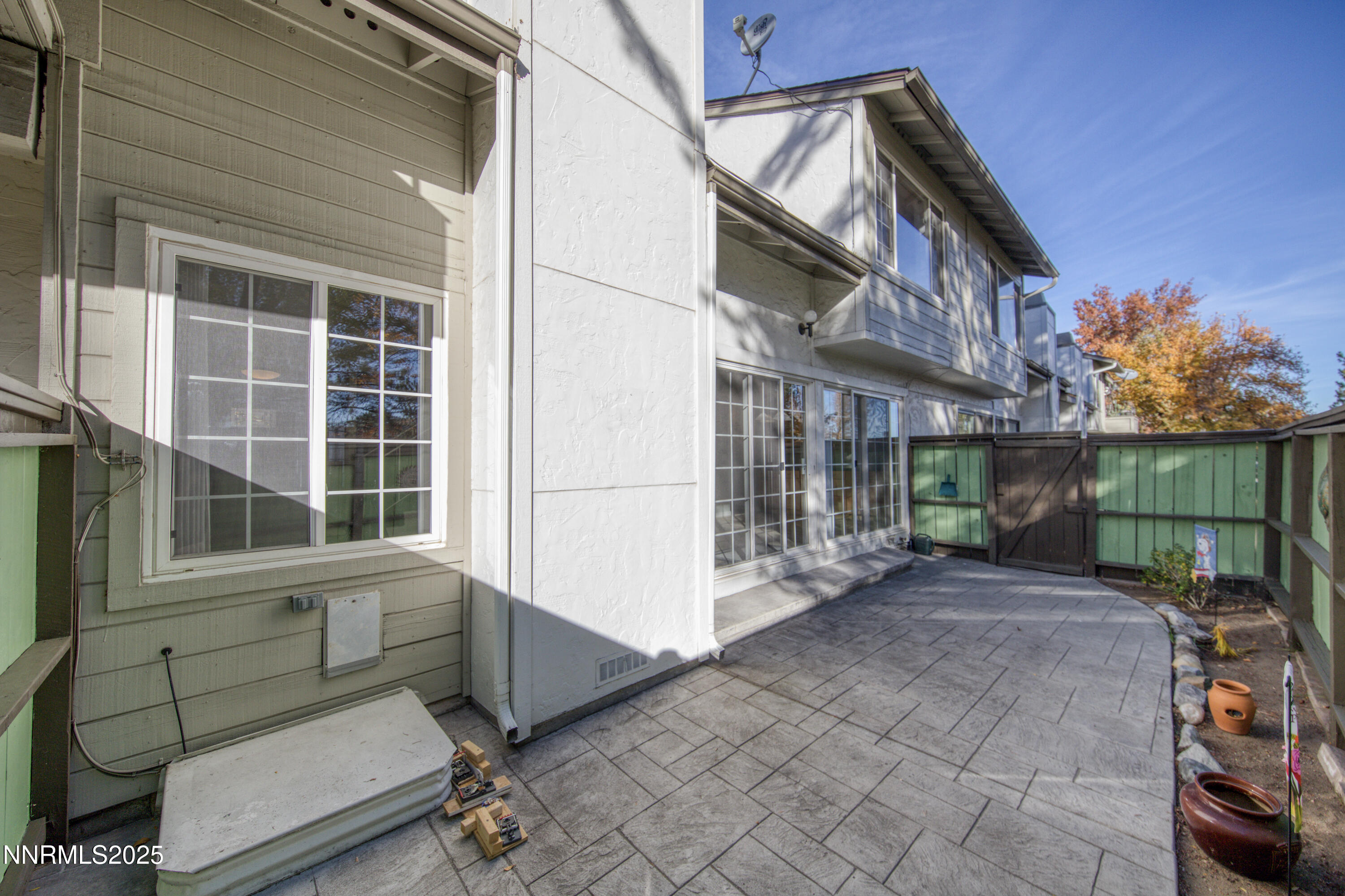4314 Clyde Court Reno, NV 89509 - Photo 40 of 46 a view of a house with a large window and wooden fence