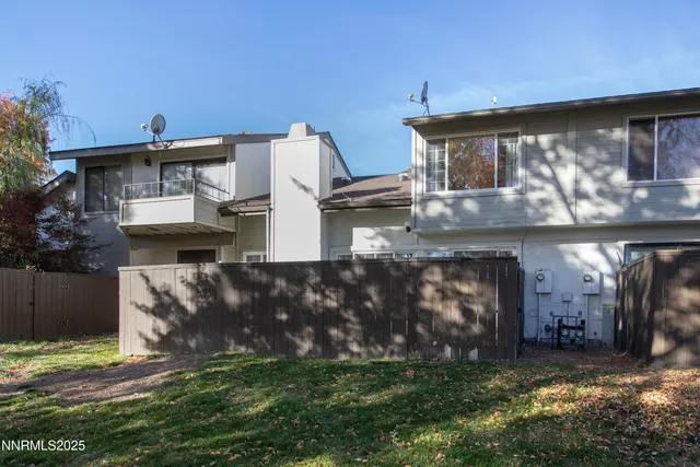 a view of a livingroom with table and a couch