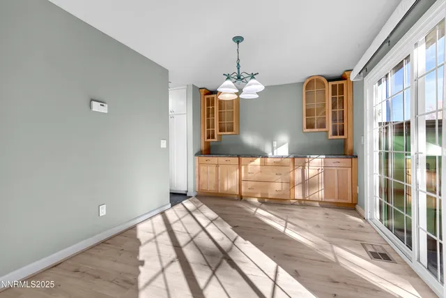 a front view of a house with a large window