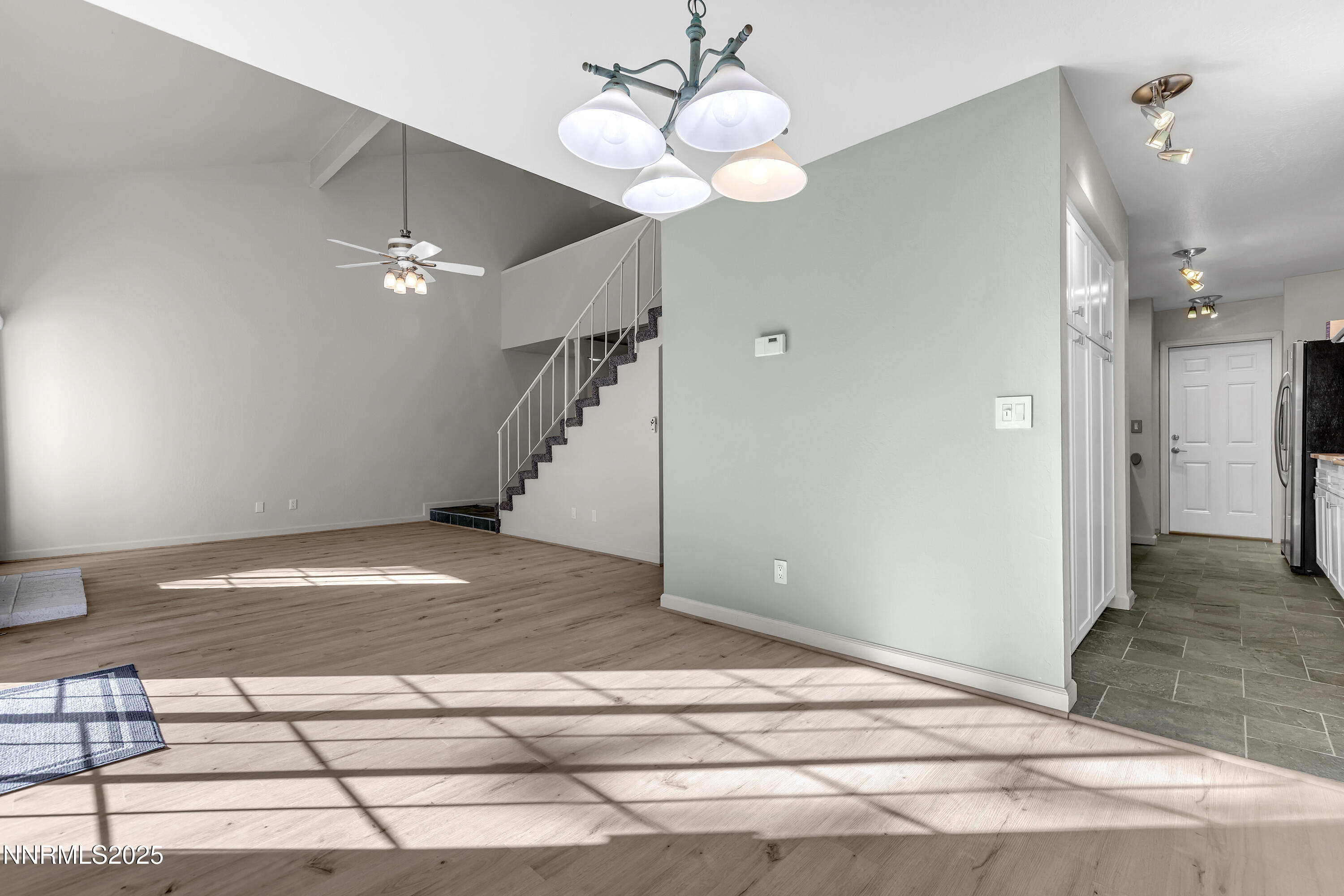 4314 Clyde Court Reno, NV 89509 - Photo 8 of 46 a view of a livingroom with wooden floor and a ceiling fan