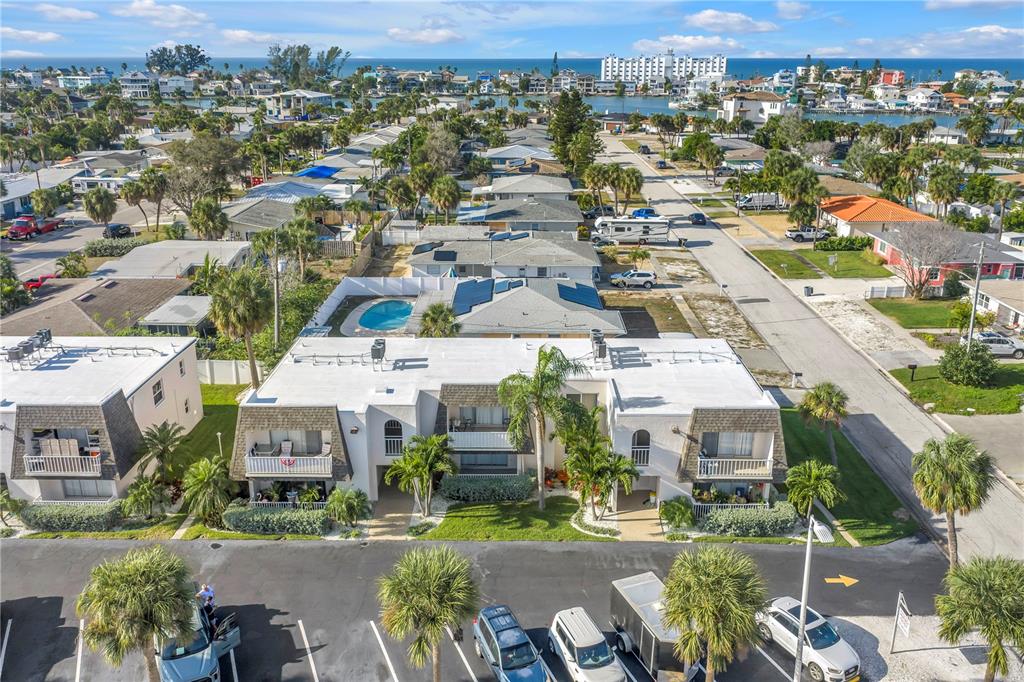 8630 Blind Pass Road St. Pete Beach, FL 33706 - Photo 7 of 26 an aerial view of a city with lots of residential buildings