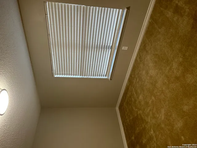 a view of a room with a window