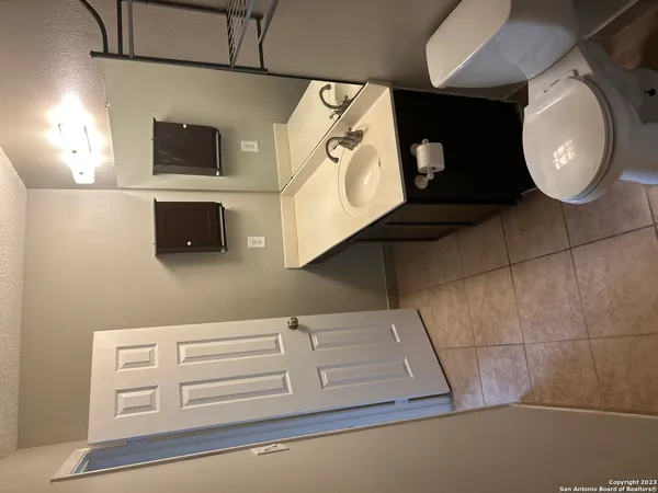 a bathroom with a mirror and a sink