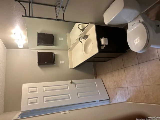 a bathroom with a mirror and a sink