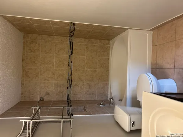 a bathroom with a shower and a tub